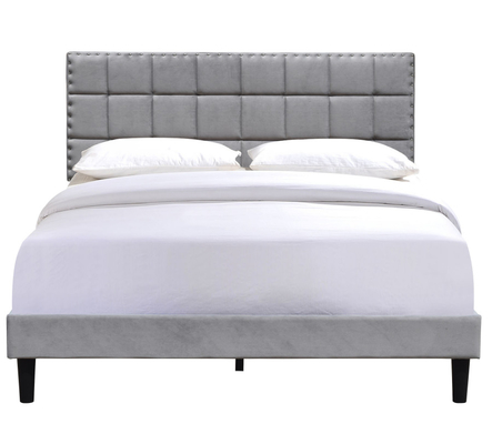 Cama gemela tapizada gris con botones de tela capitoné y líneas cuadradas